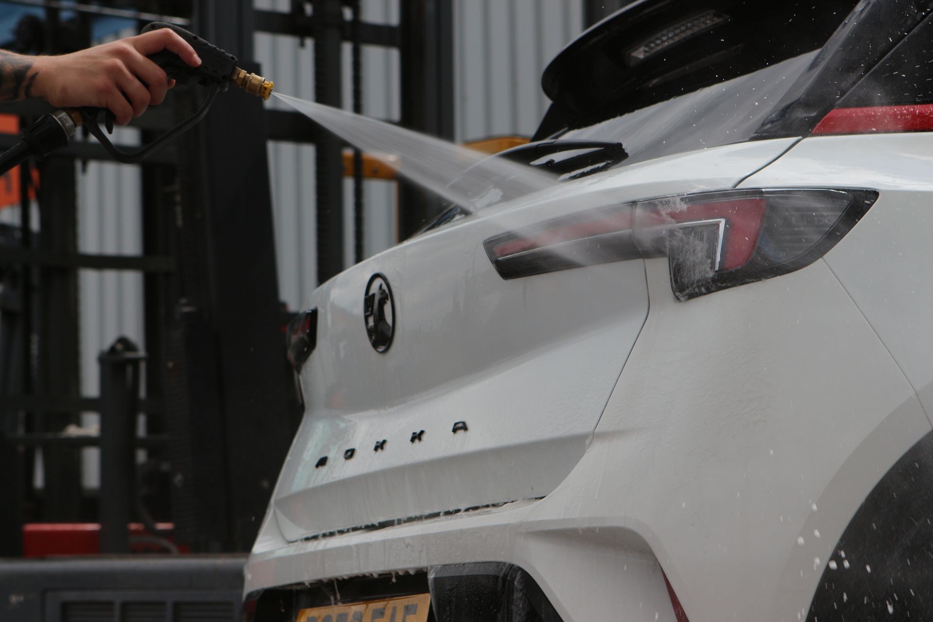 Car being sprayed with purified water